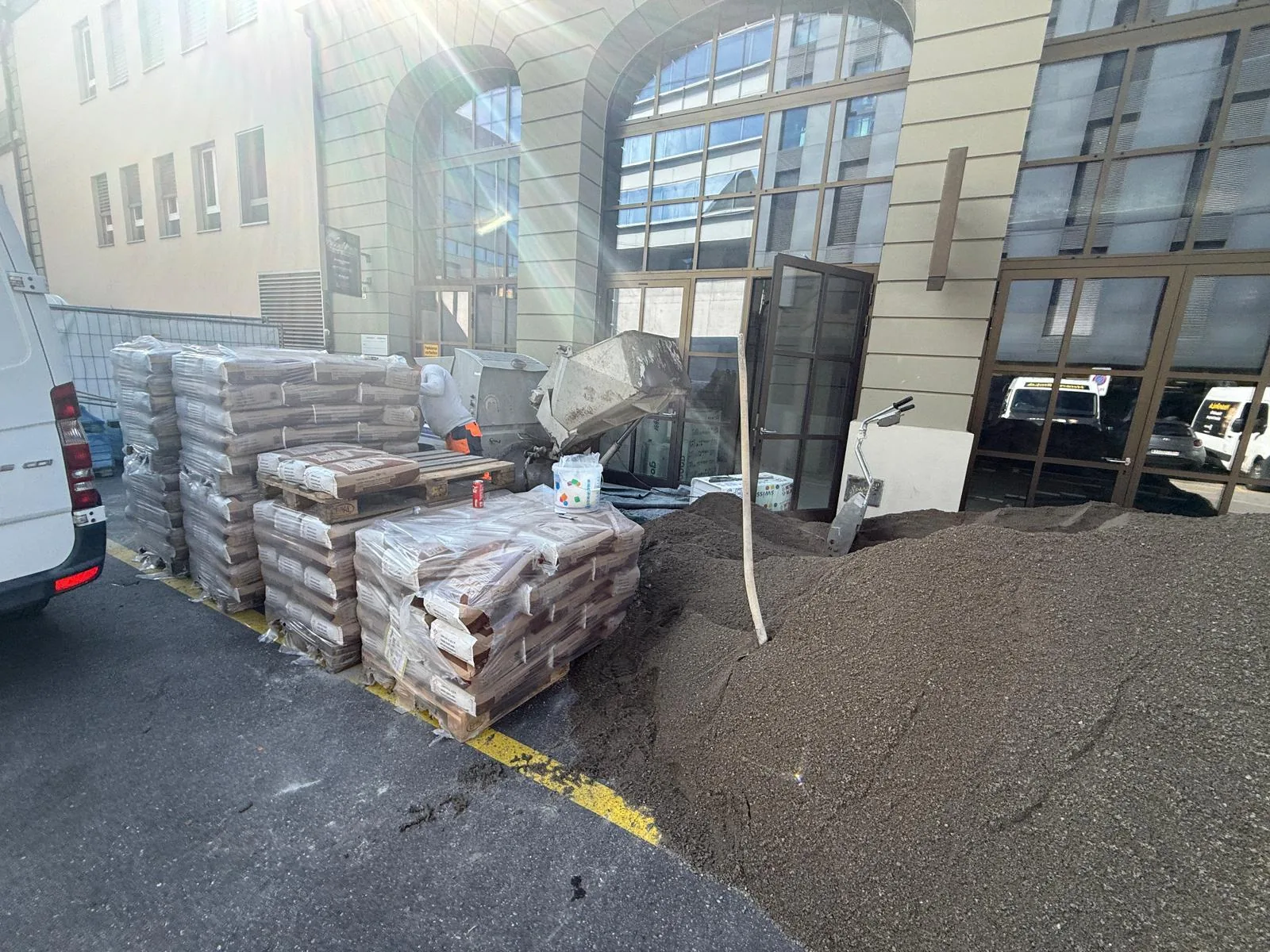 Pallet of construction materials freshly delivered to the Merkurgässli site