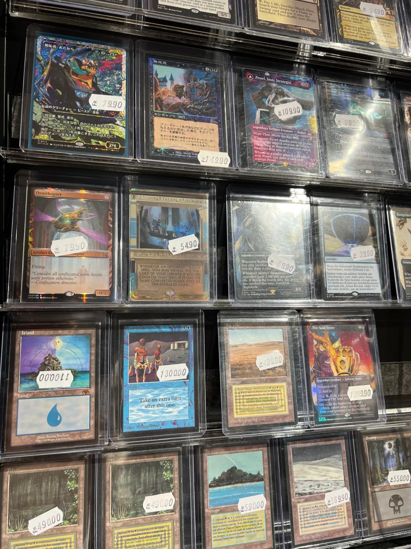 Rare Magic: The Gathering singles in cases with price tags